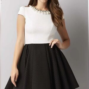 Chic Black and White Dress with Pearl Detail